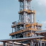 Industrial oil processing plant with piping against the sky