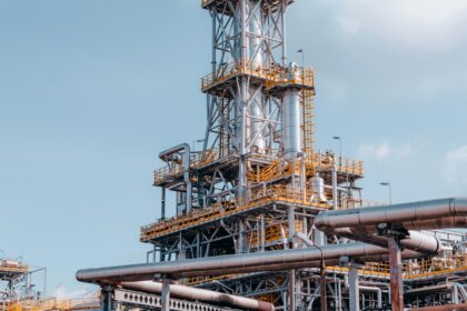 Industrial oil processing plant with piping against the sky