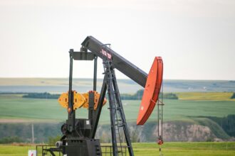 Pumpjack operating in a prairie field