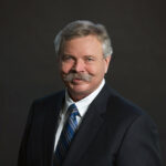 Portrait of Charlie Fischer, Alberta Order of Excellence member and former President and CEO of Nexen
