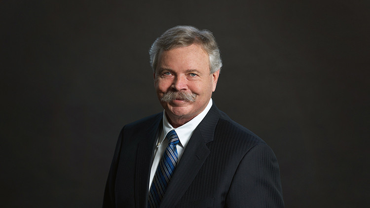 Portrait of Charlie Fischer, Alberta Order of Excellence member and former President and CEO of Nexen