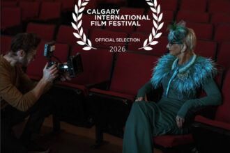Diana Monea photographed in a theatre beneath a Calgary International Film Festival Official Selection 2026 laurel