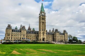 Parliament building in Ottawa under an overcast sky