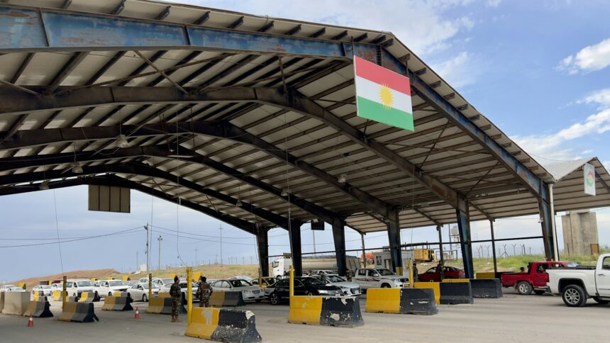 A road border crossing canopy with vehicle lanes beneath it