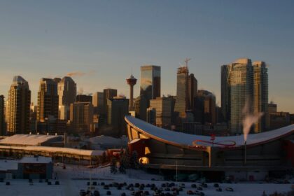 The Calgary skyline at dusk seen from Scotsman's Hill
