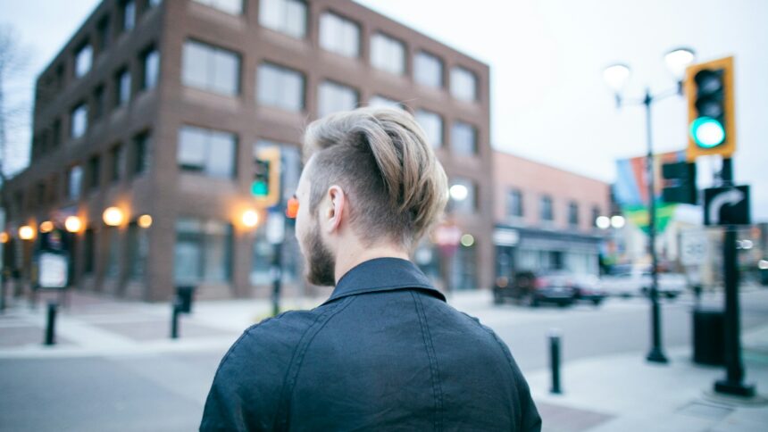 A man walking along a downtown street in Red Deer, Alberta