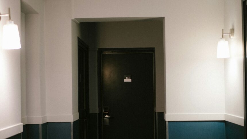 Closed bedroom doors along a narrow upstairs hallway
