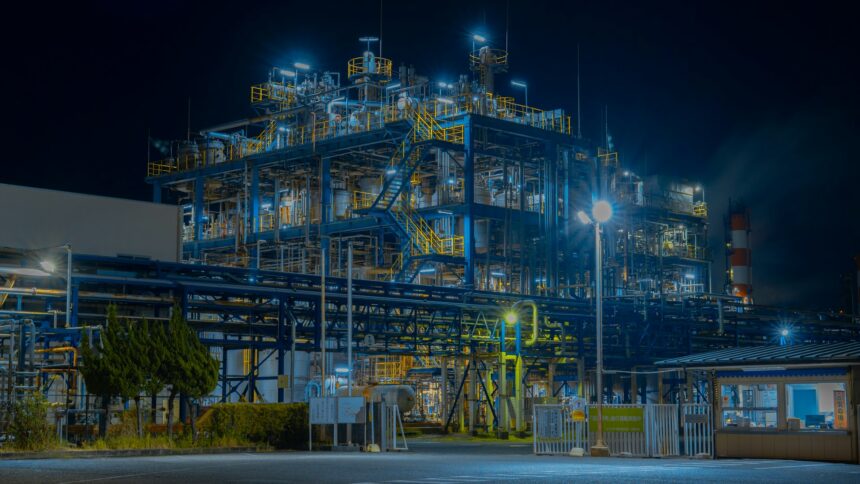 A large industrial gas processing plant lit up after dark