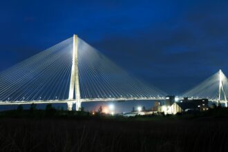 The Gordie Howe International Bridge lit up at night from the Windsor side