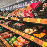 Grocery store produce shelves with sale price tags