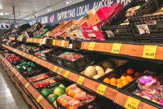 Grocery store produce shelves with sale price tags