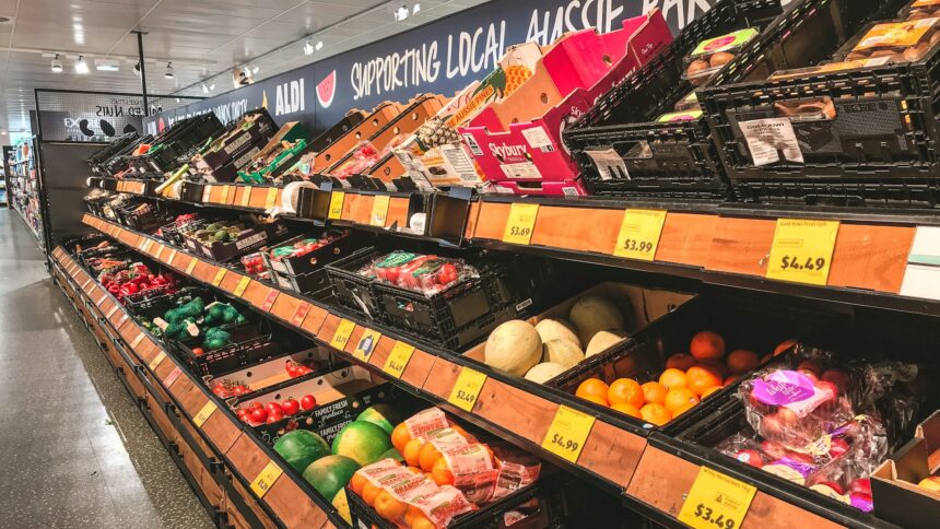 Grocery store produce shelves with sale price tags