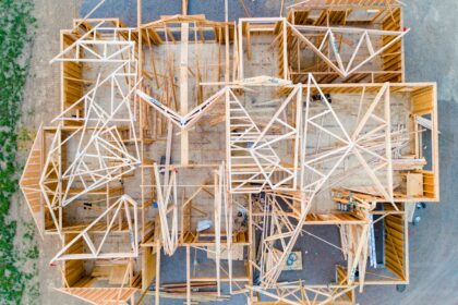 An overhead view of the wooden framing of a house under construction