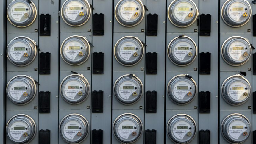 A household electric meter mounted on an exterior wall
