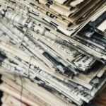 A stack of folded newspapers