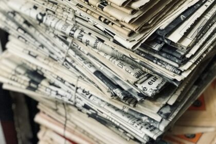 A stack of folded newspapers