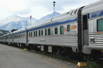 Stainless steel passenger rail cars at the station in Jasper, Alberta