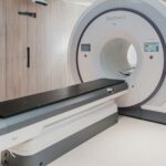 A magnetic resonance imaging scanner standing in an empty hospital room