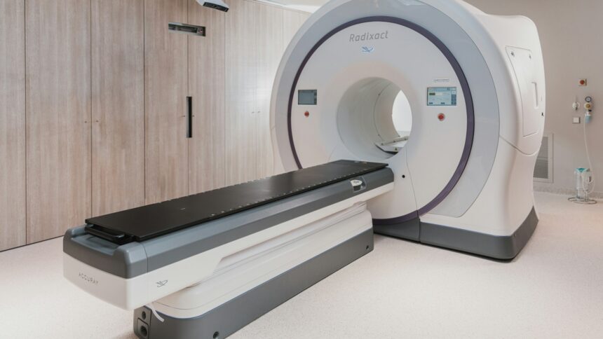 A magnetic resonance imaging scanner standing in an empty hospital room