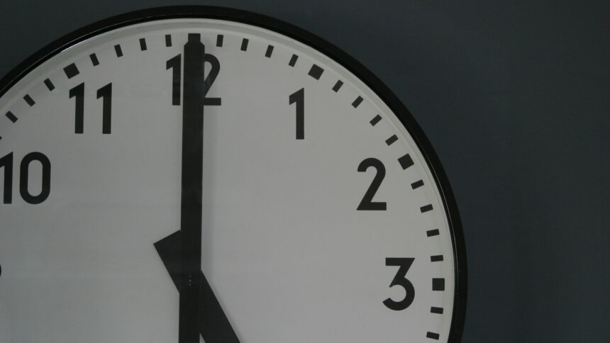 A close-up of a wall clock face