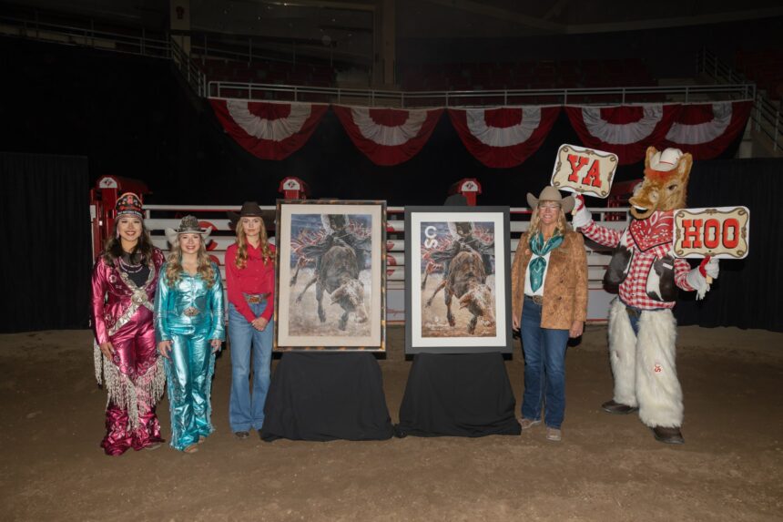 Two framed paintings of a bull rider on a bucking bull on display in an arena, with people standing beside them