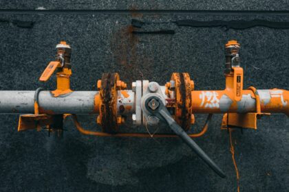 Orange valve assembly on a gas pipeline fitting